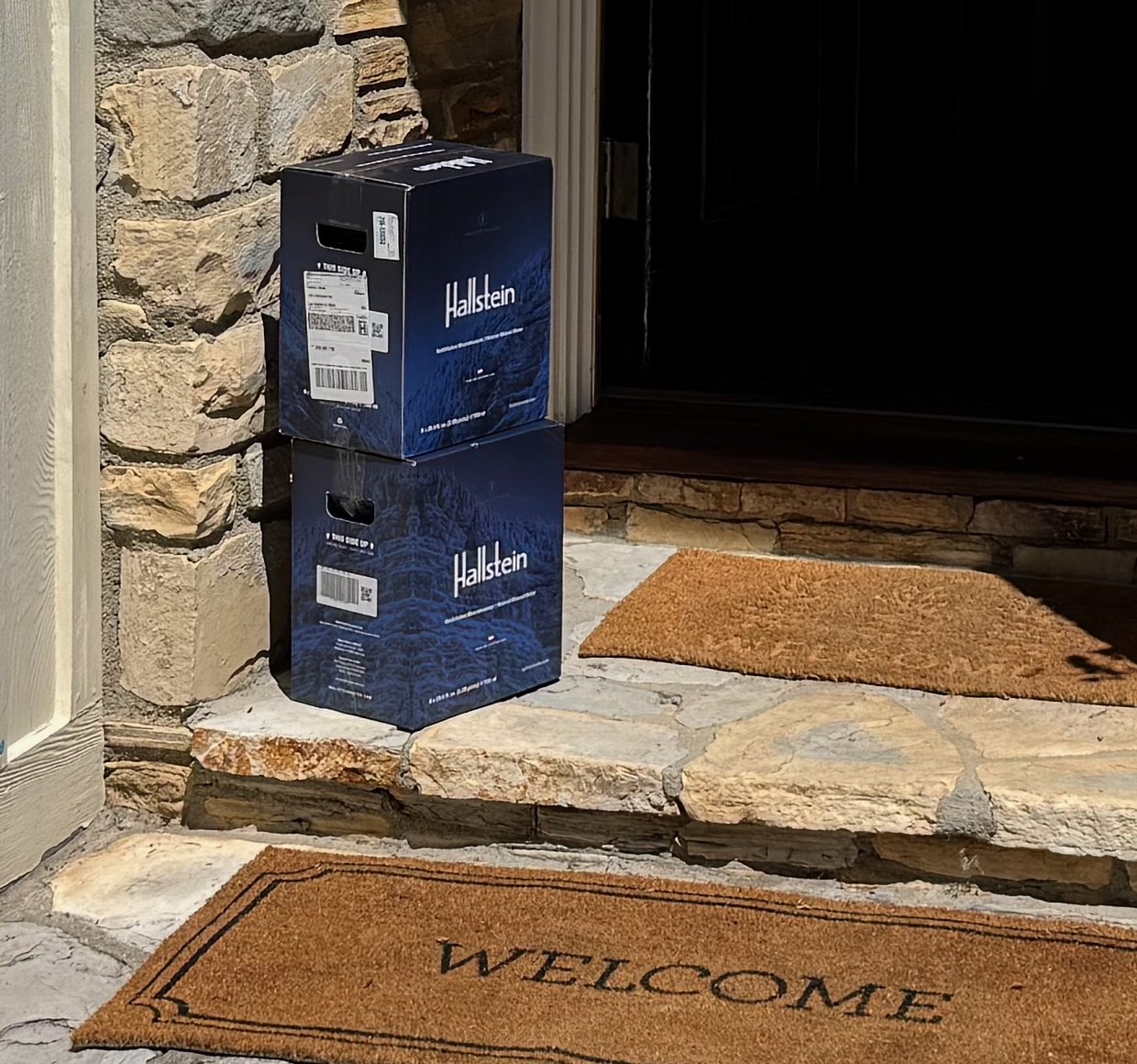 Two Hallstein Water cases delivered to a doorstep